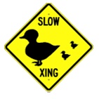 Slow Duck Crossing Warning sign